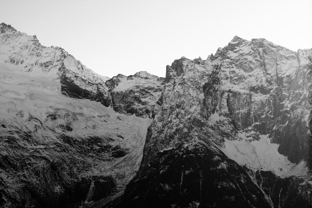 a black and white photo of a mountain range