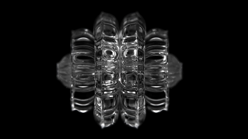 a black and white photo of a glass object