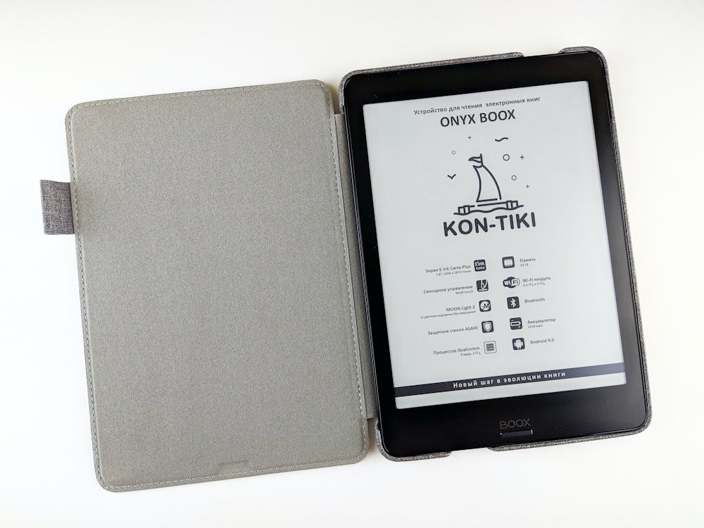 a kindle case with a book on top of it