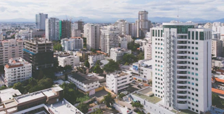 an aerial view of a city with tall buildings