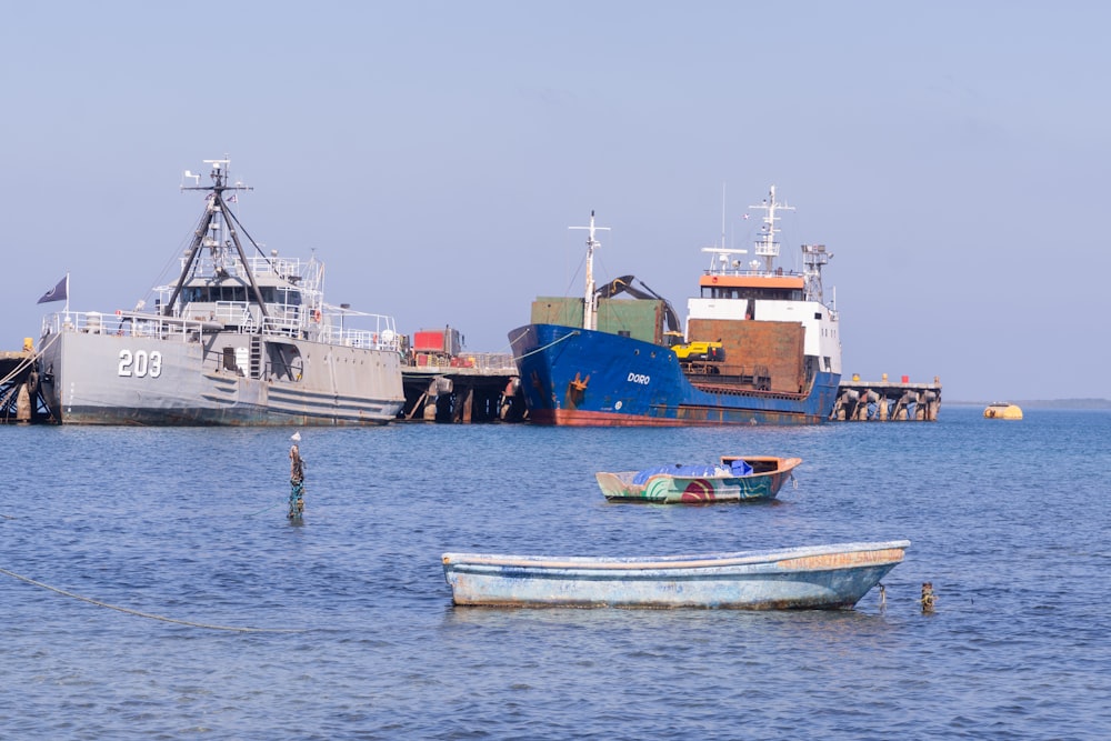 two boats in the water near a dock