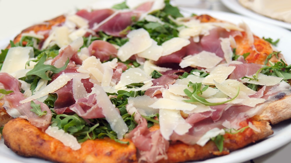 a close up of a pizza on a plate on a table