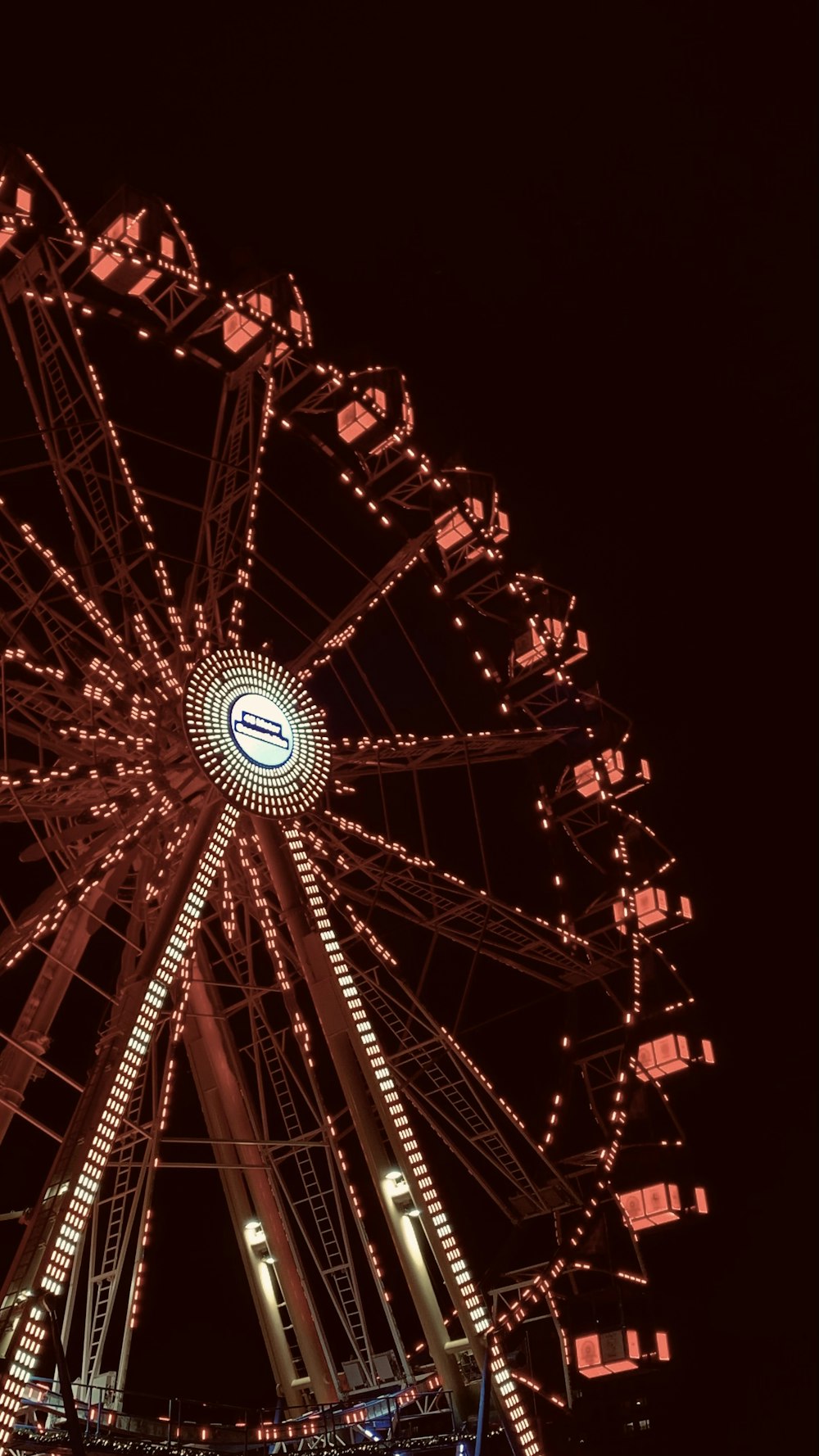 a large ferris wheel lit up at night