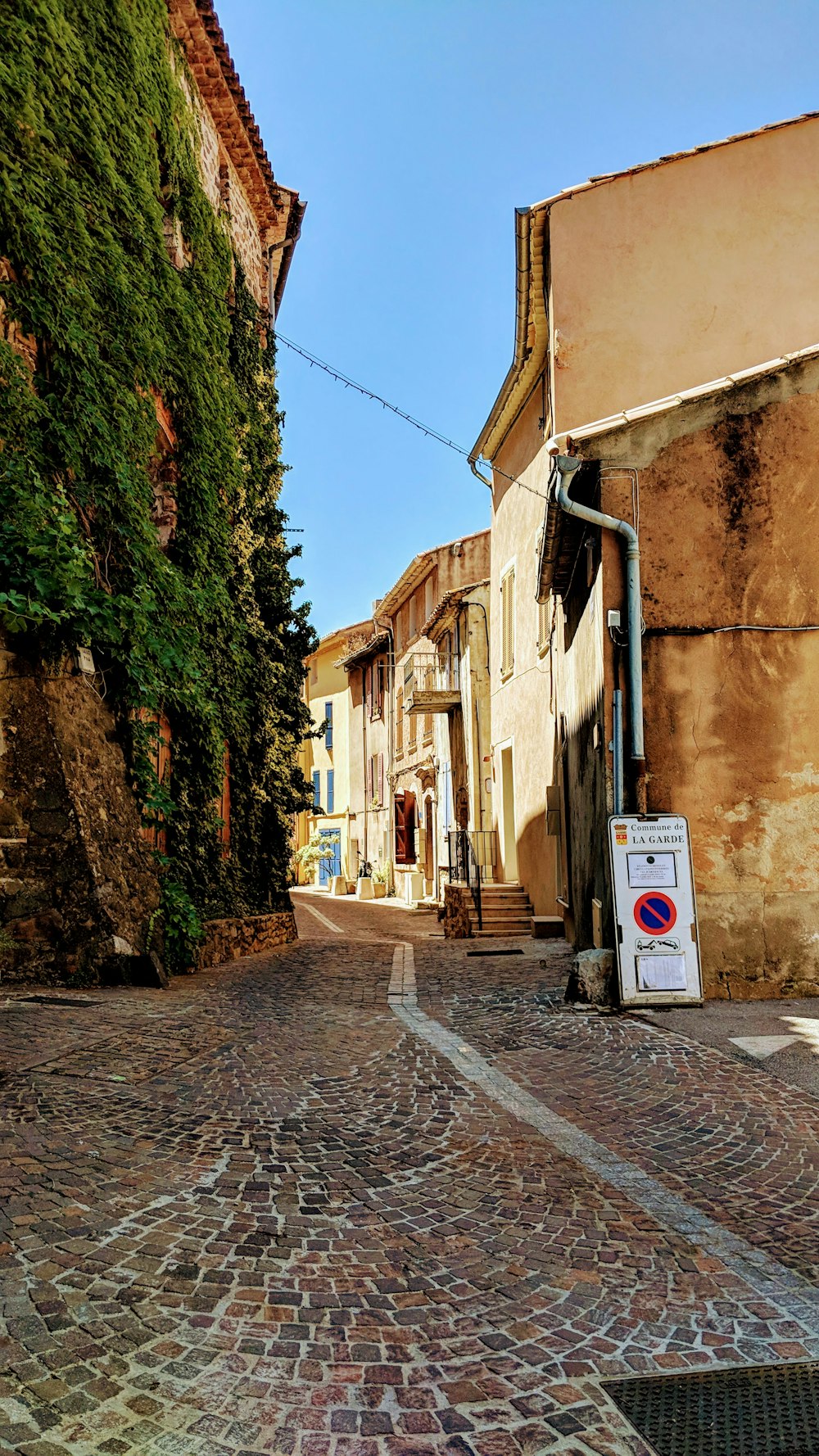 a cobblestone street in a small town