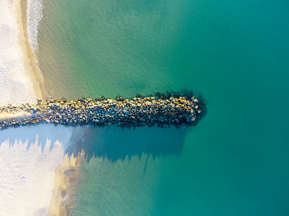 a bird's eye view of a beach and water