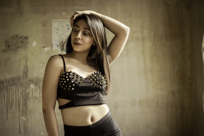 Confident BBW woman in a black bra top posing