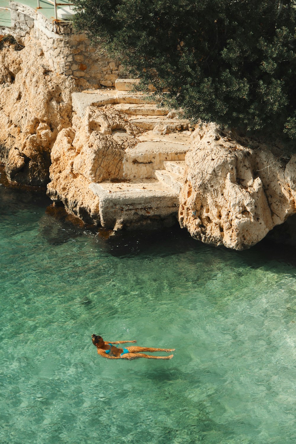 a person swimming in a body of water