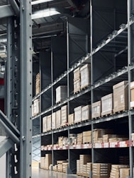 Stainless steel shelving units shining under warehouse lights.
