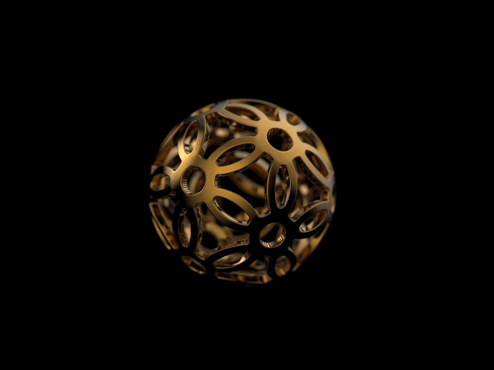 a gold object with a black background