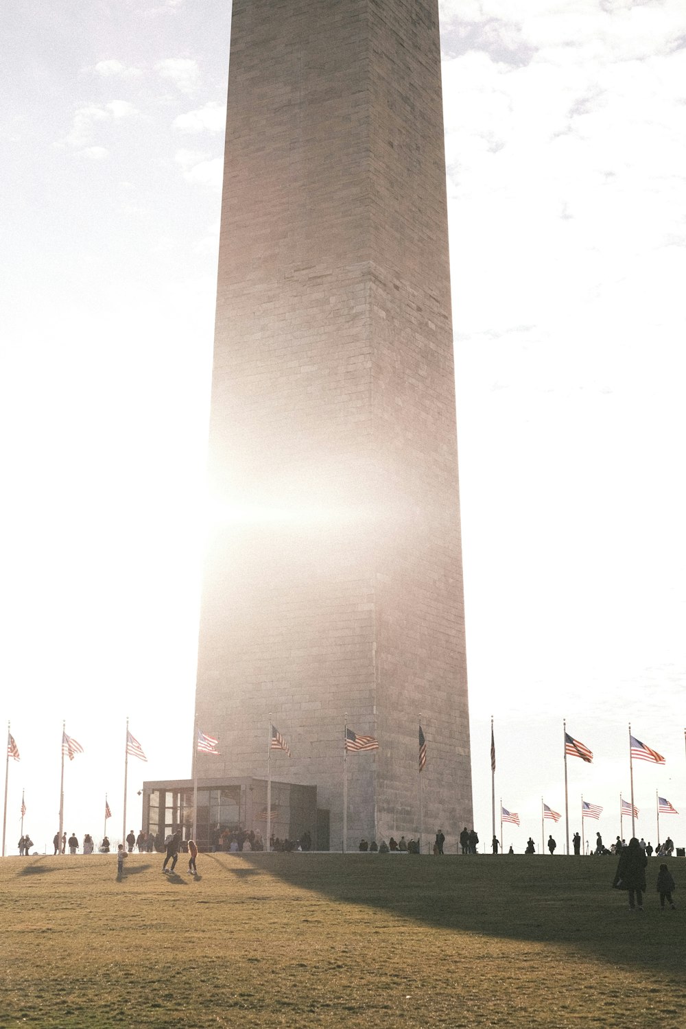 a tall tower with a flag on top of it