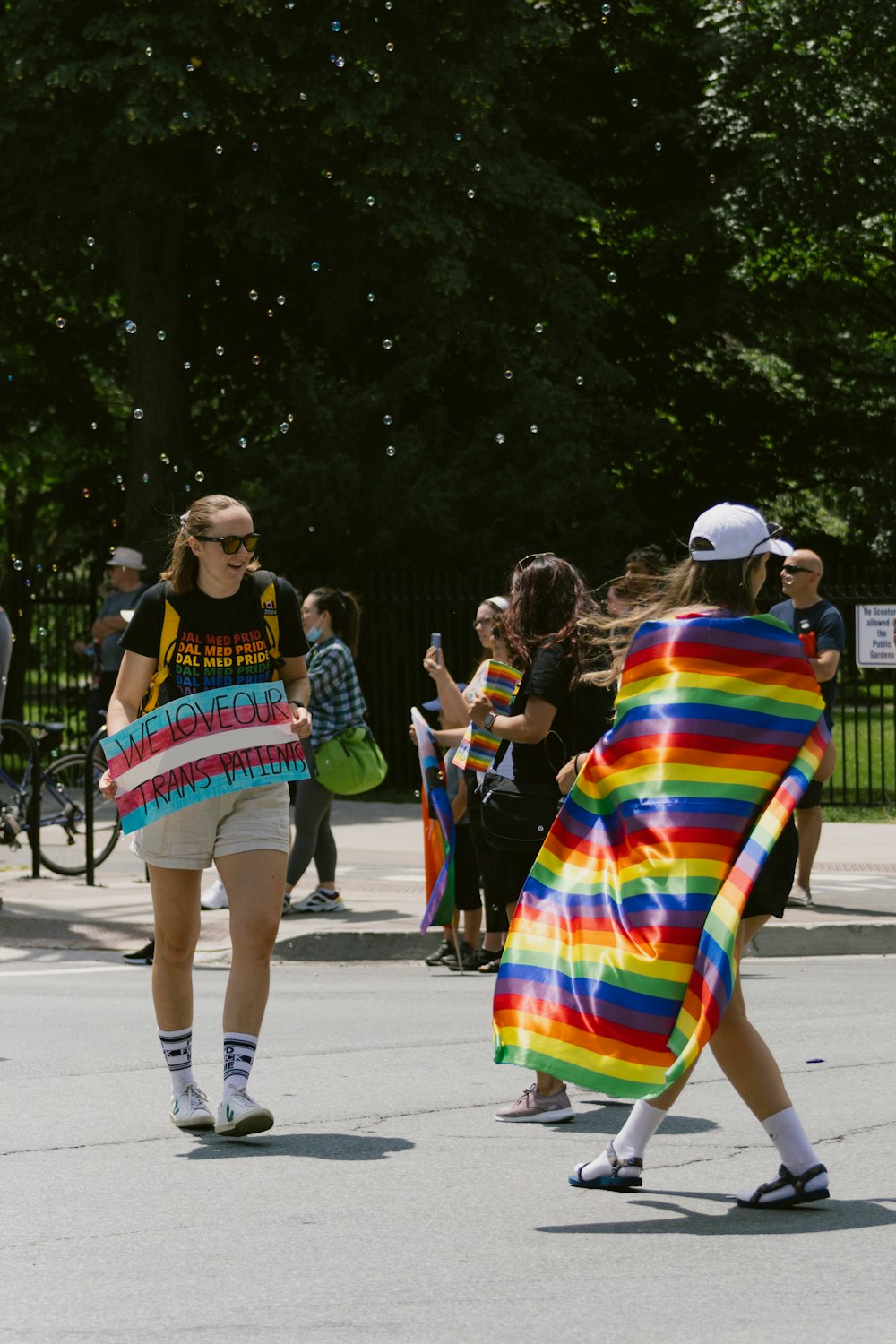 a group of people walking down a street