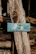 Laser-engraved wooden sign featuring a fishing motif with natural wood grain.