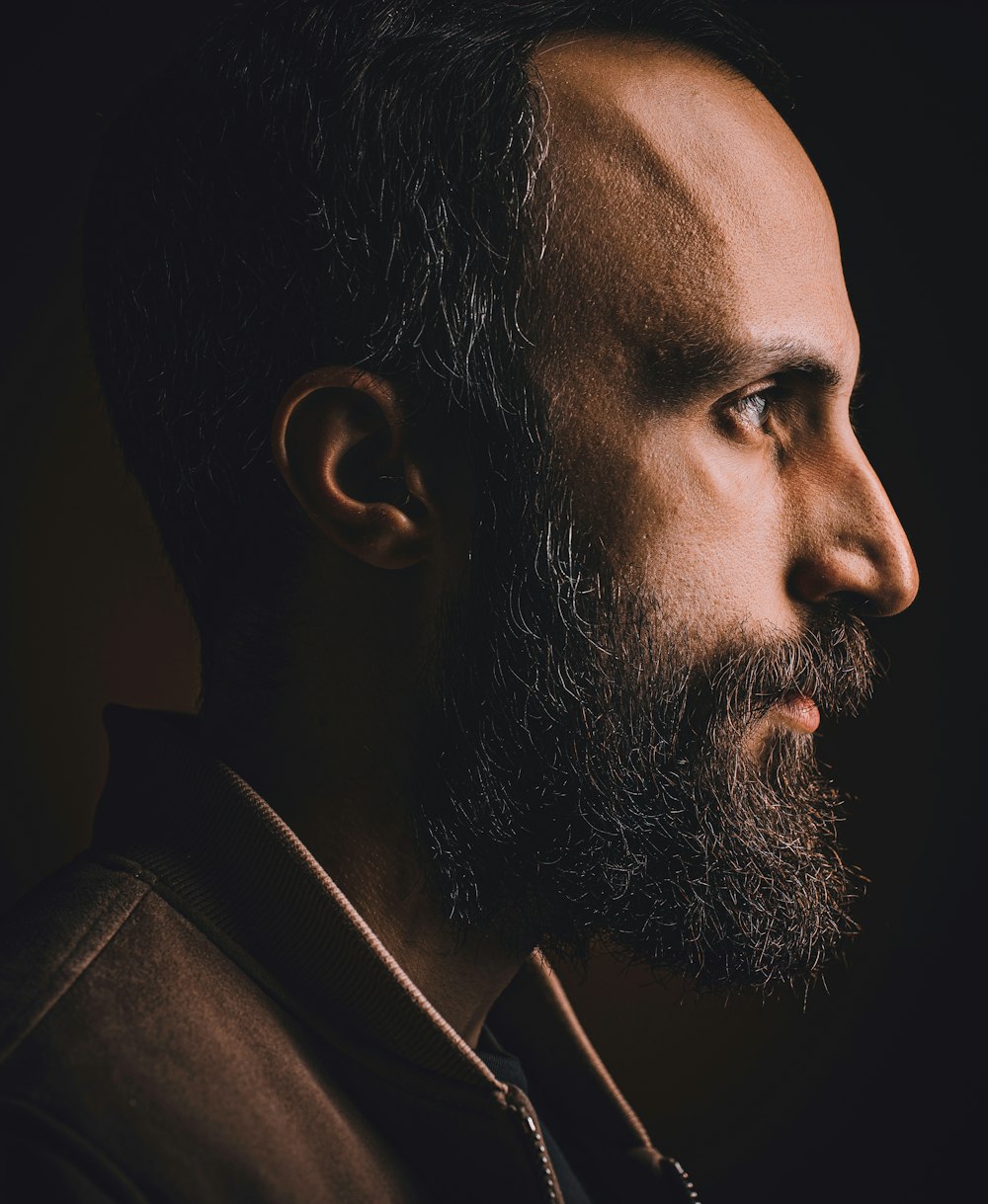 a close up of a man with a beard