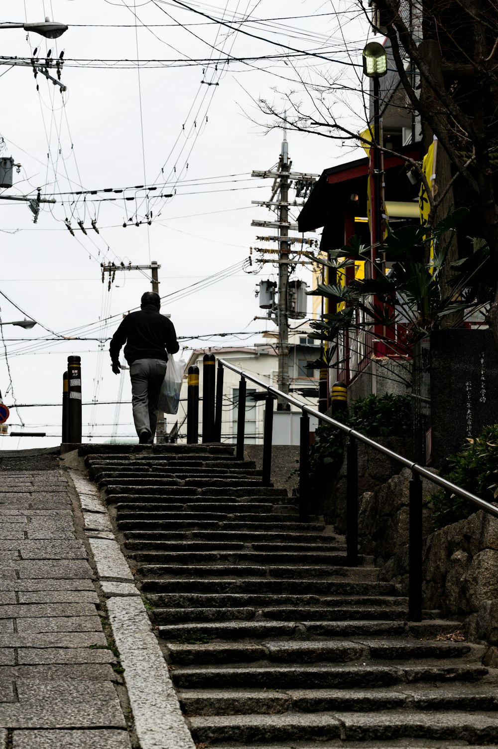 a man walking down a set of stairs