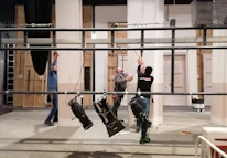 Lighting technicians adjusting Arri Skypanel lights to create the perfect mood on set.