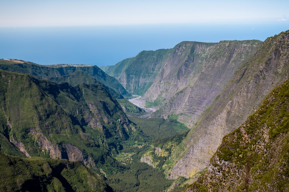 a view of a valley with mountains in the background