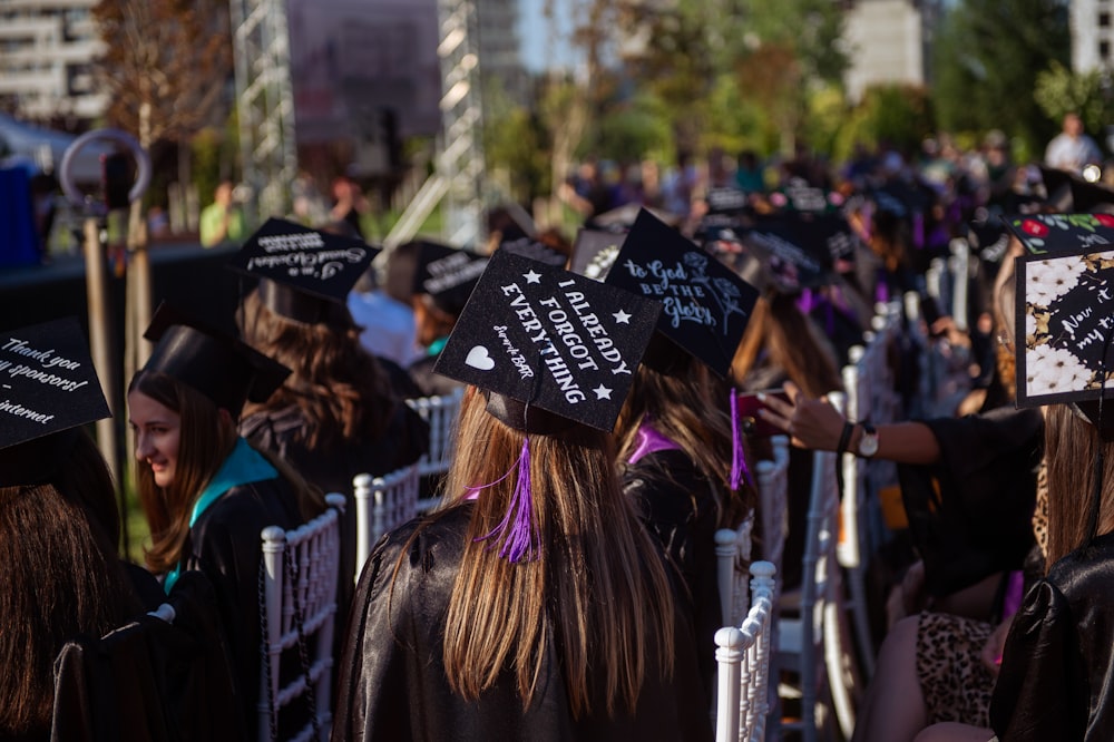 a group of people in graduation caps and gowns