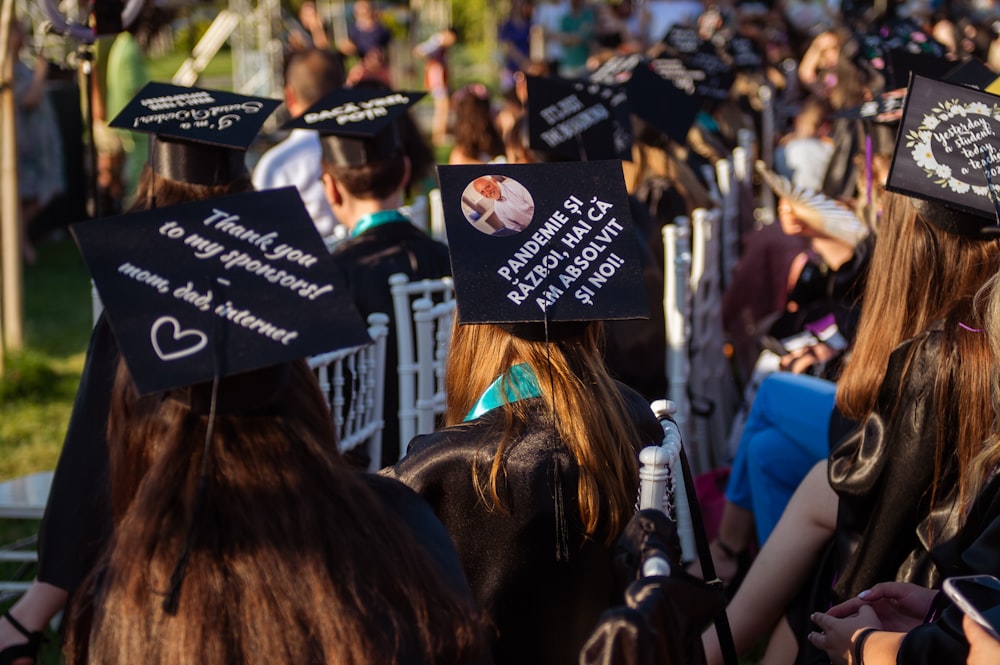 a group of people in graduation caps and gowns