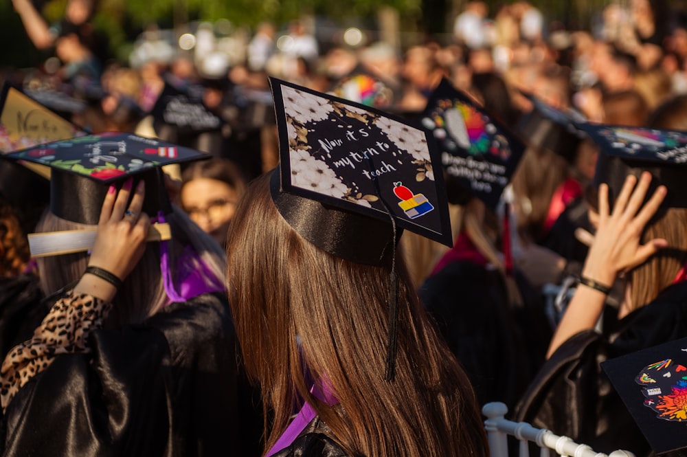 a group of people in graduation caps and gowns