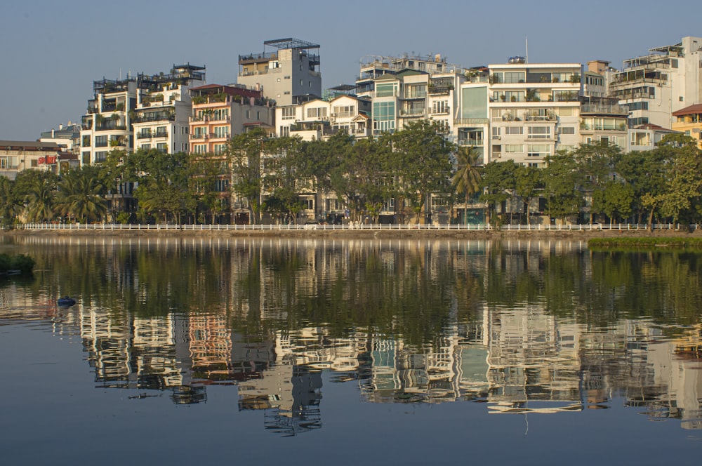 a body of water with buildings in the background