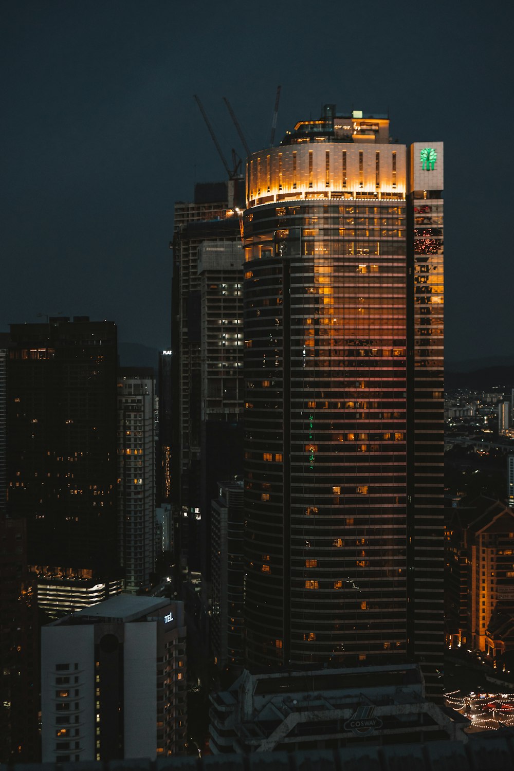 a very tall building with a lot of lights on top of it