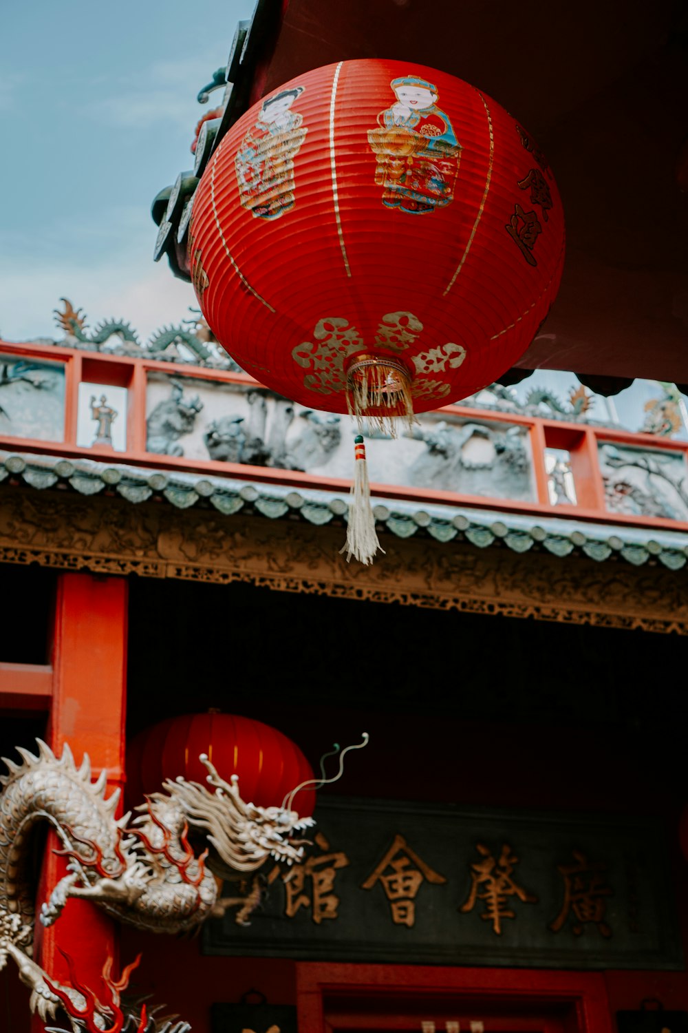 a red lantern hanging from the ceiling of a building