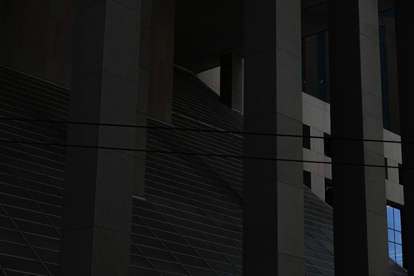 a clock on the side of a building at night