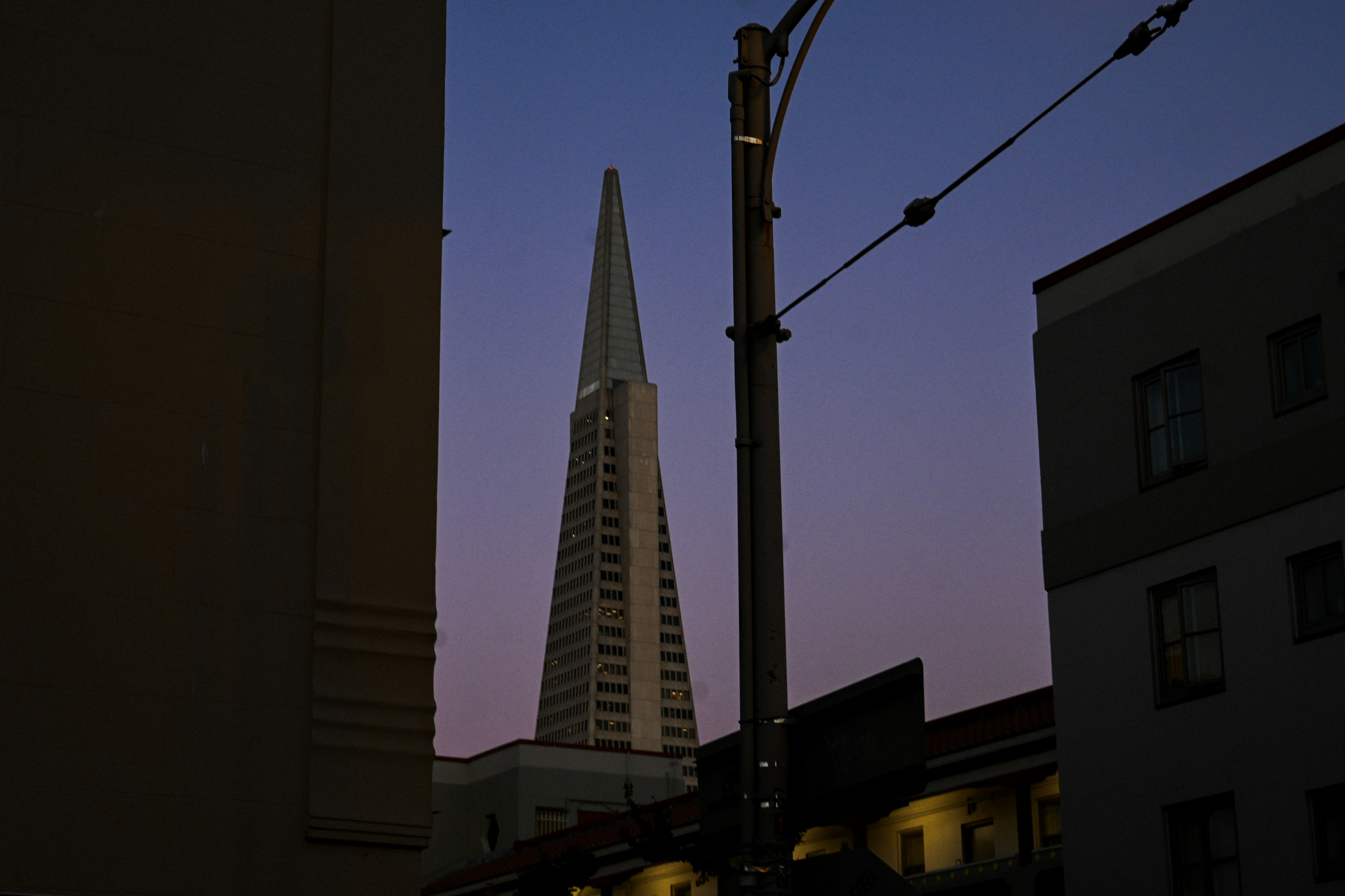 a very tall building towering over a city
