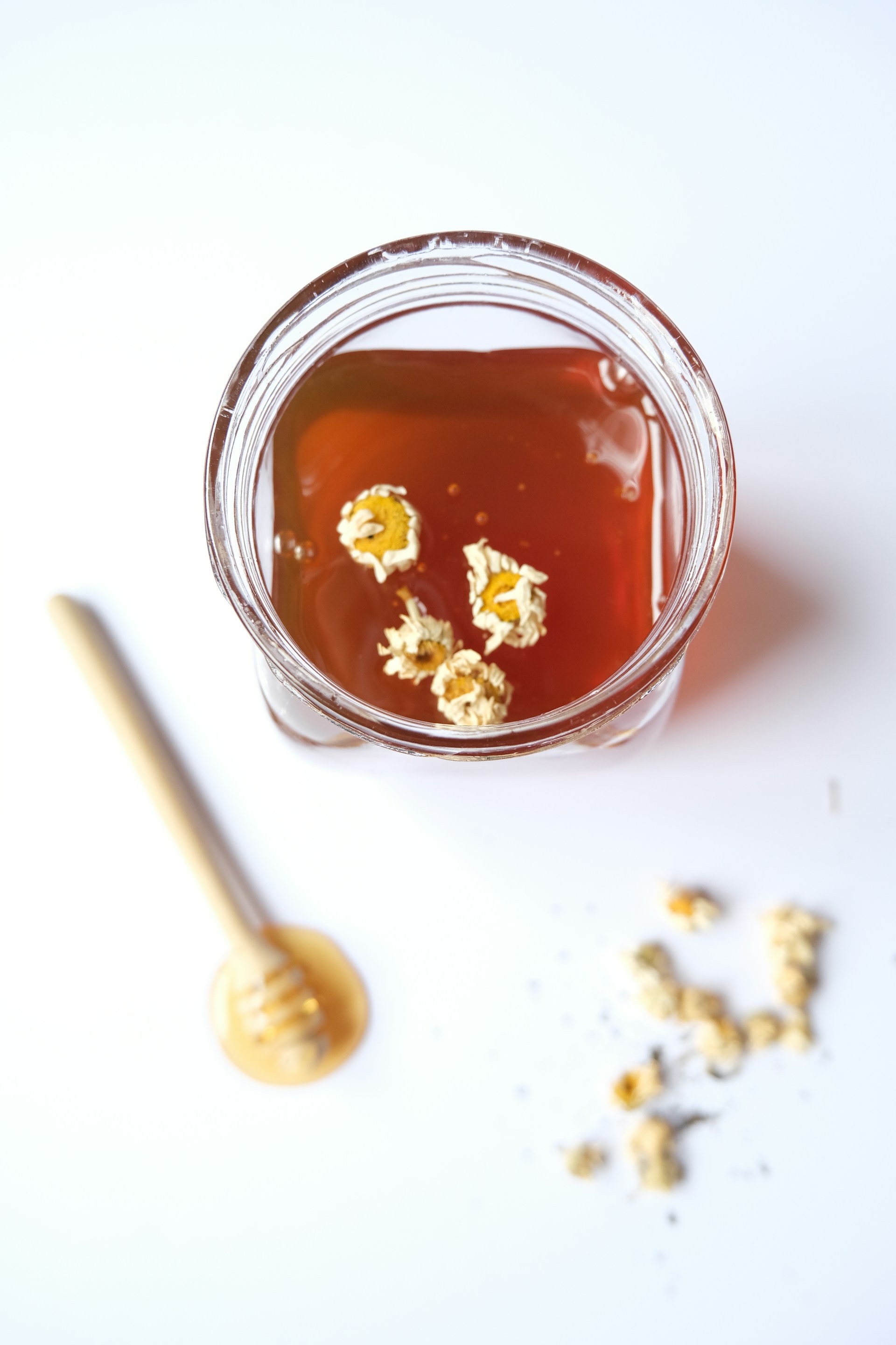a jar filled with liquid and gold flakes