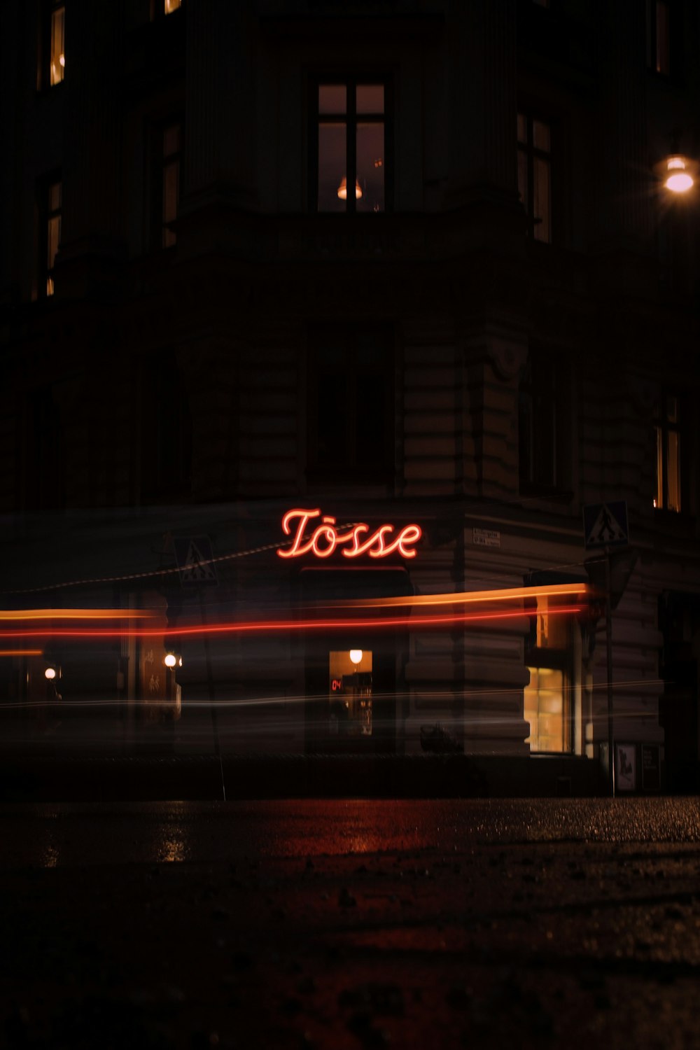 a building with a sign that says touse lit up at night