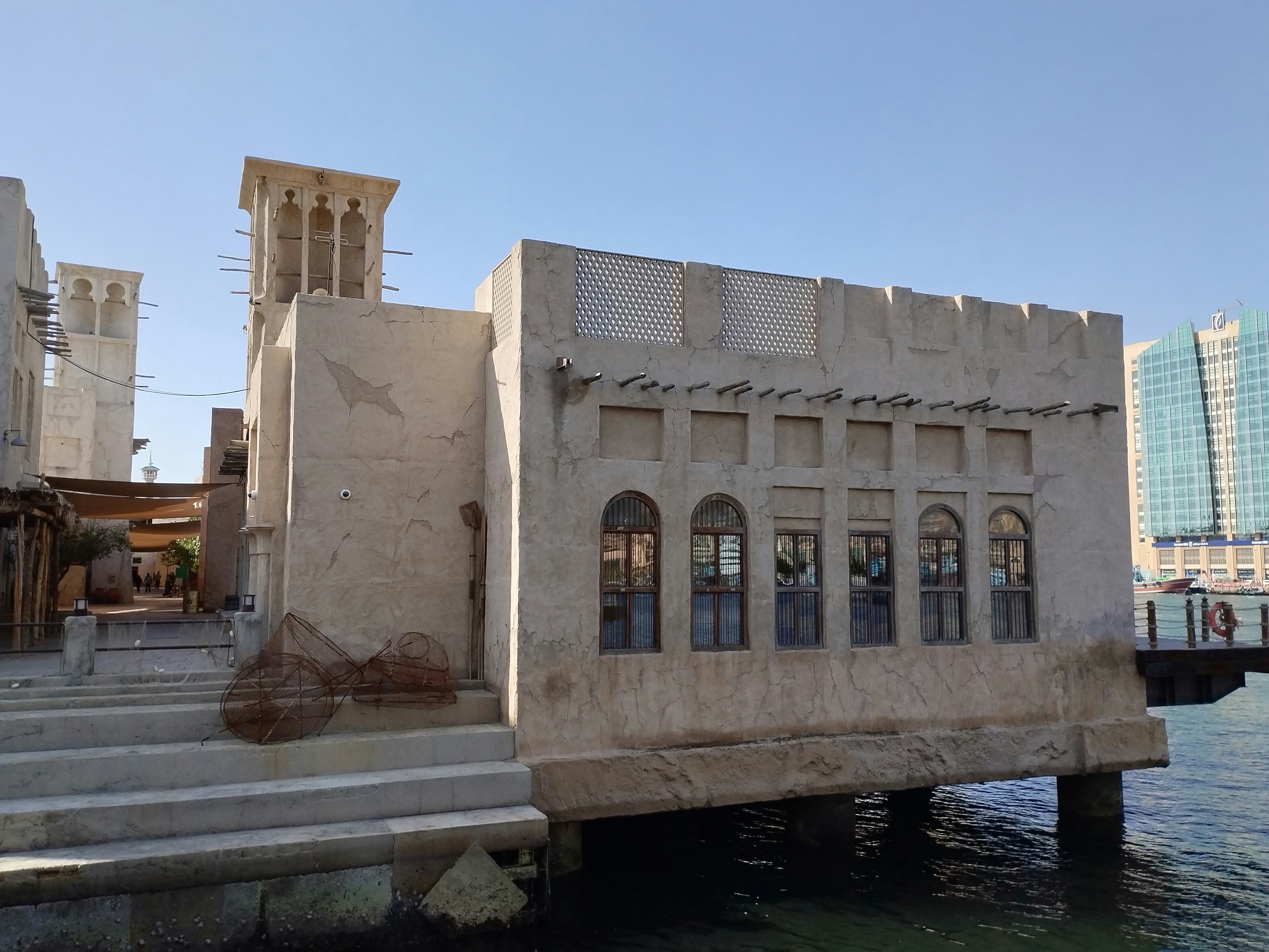 a building sitting next to a body of water