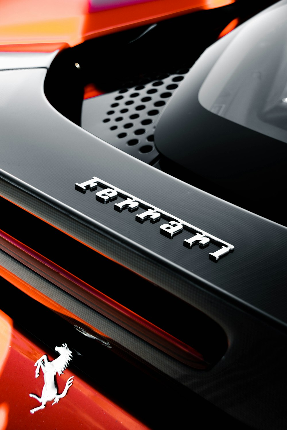 a close up of the hood of a sports car