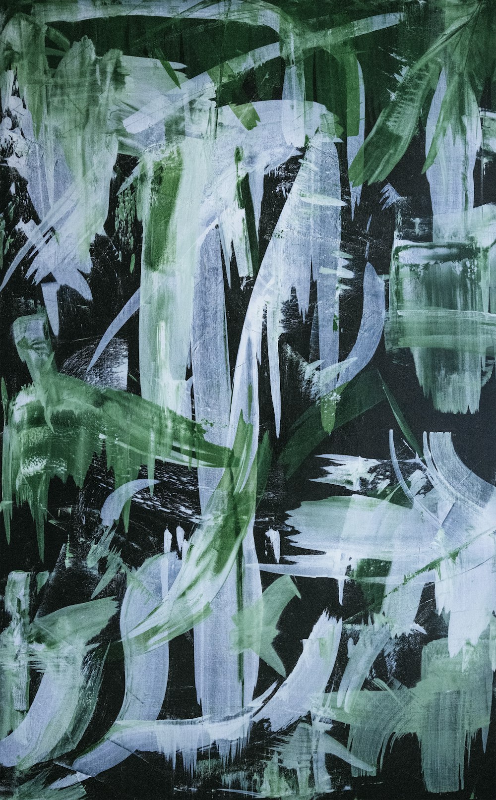 a painting of green and white leaves on a black background