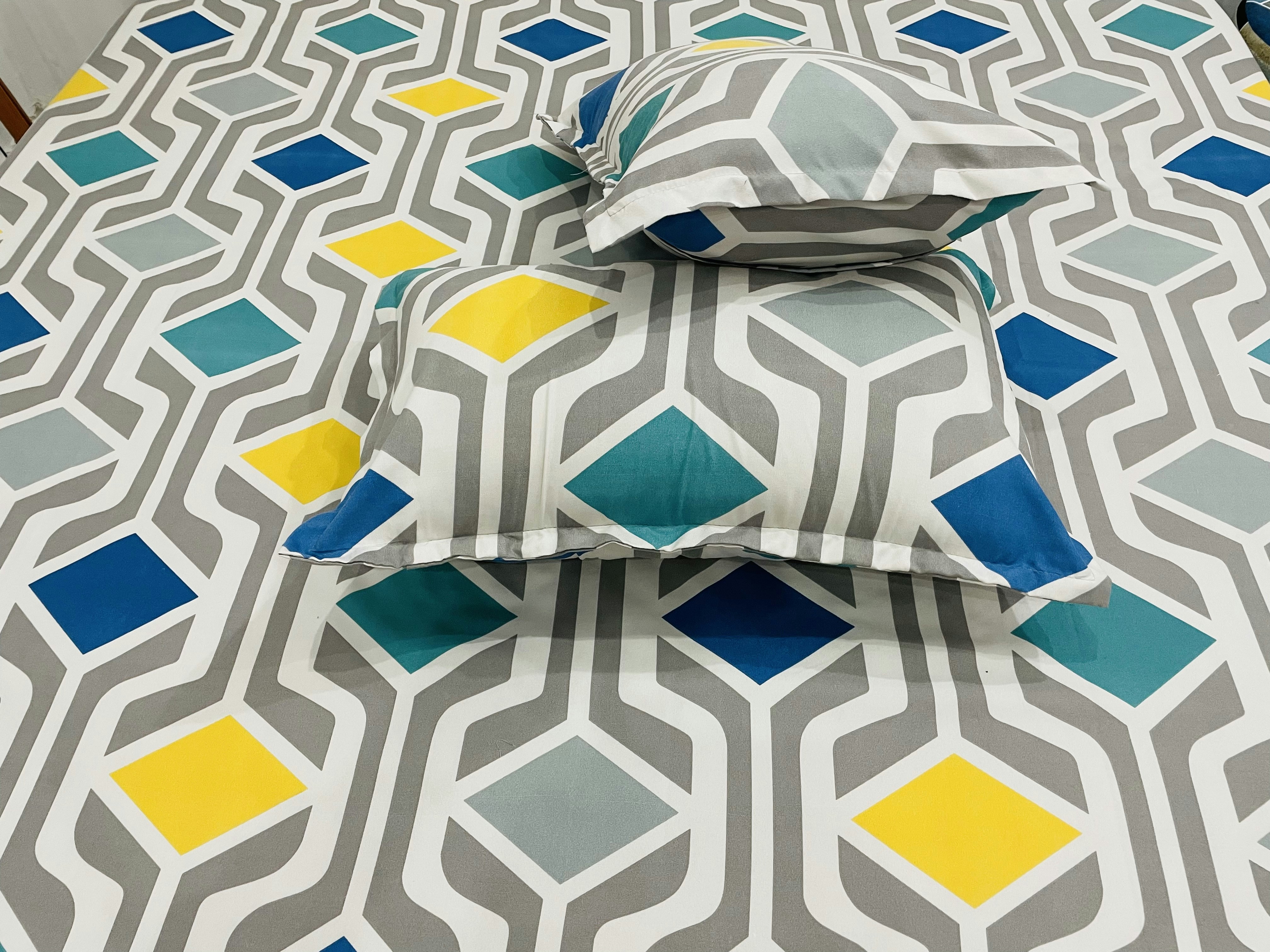 Soft decorative throw pillows with geometric patterns in coral and blue colors for couch and bed