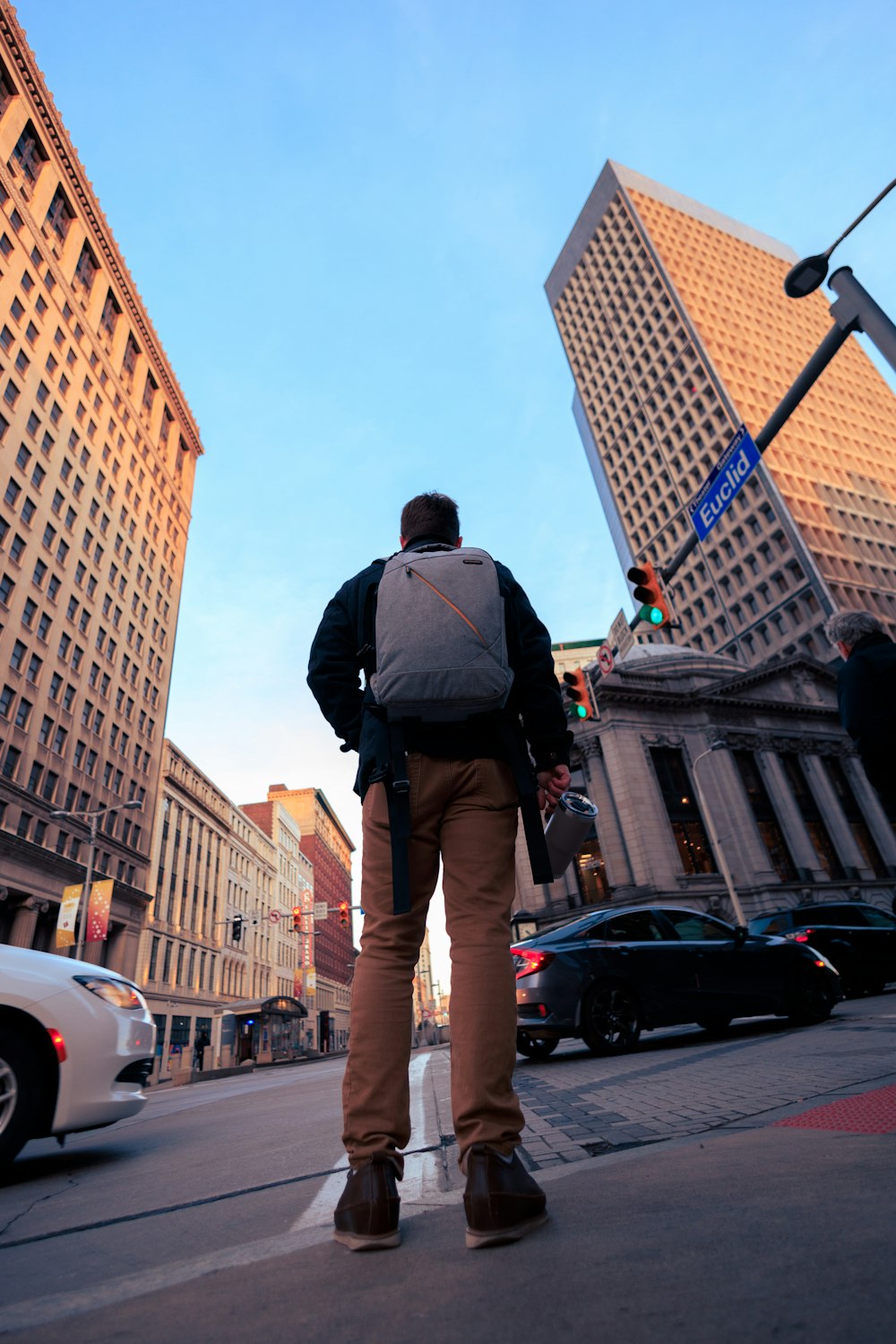 a man walking down the street in a city