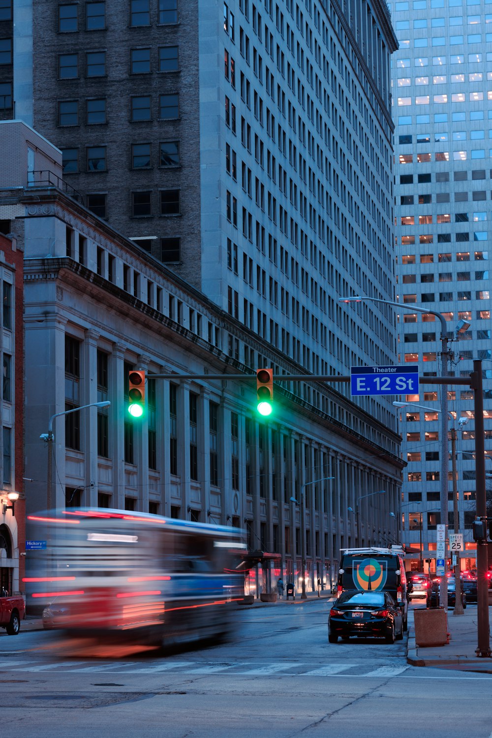 a city street filled with traffic and tall buildings