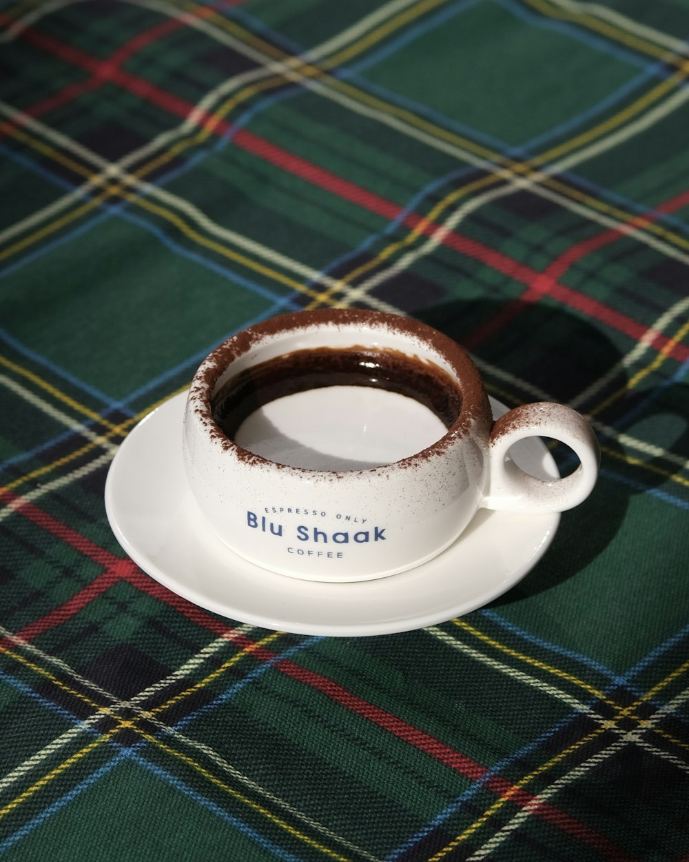 a cup of coffee sitting on top of a saucer