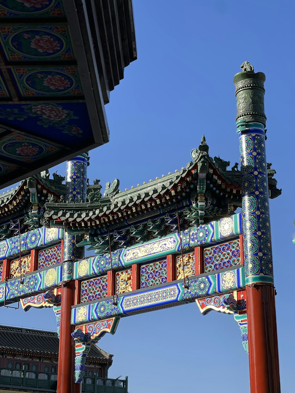a chinese building with a blue sky in the background