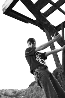 a man standing on top of a wooden structure