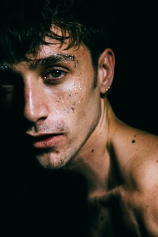 method acting: a close up of a man with freckles on his face