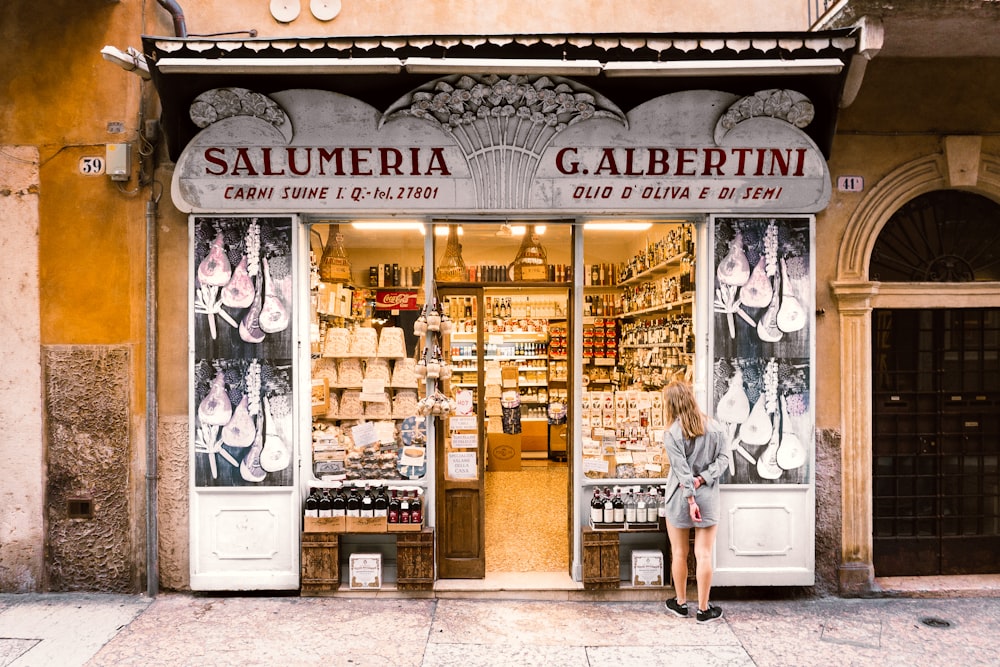 a woman standing in front of a store