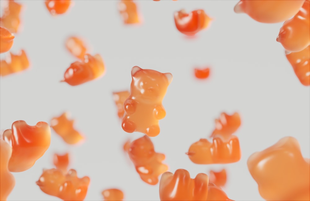 a group of gummy bears floating in the air
