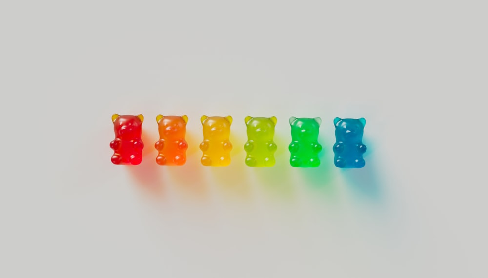 a row of gummy bears sitting next to each other