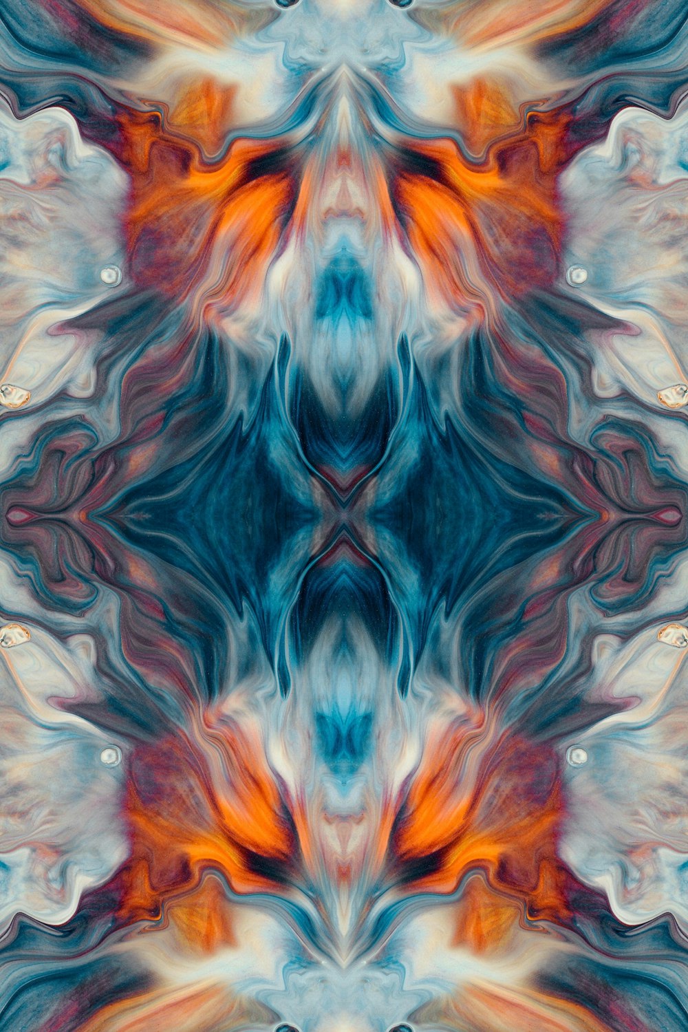 an abstract image of an orange and blue flower