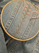 a close up of a embroidery on a pair of jeans
