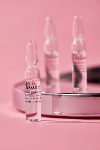 Elegant product display of peptide vials and supplements with soft clinical lighting.