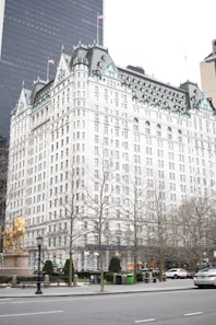 a large white building sitting next to a street