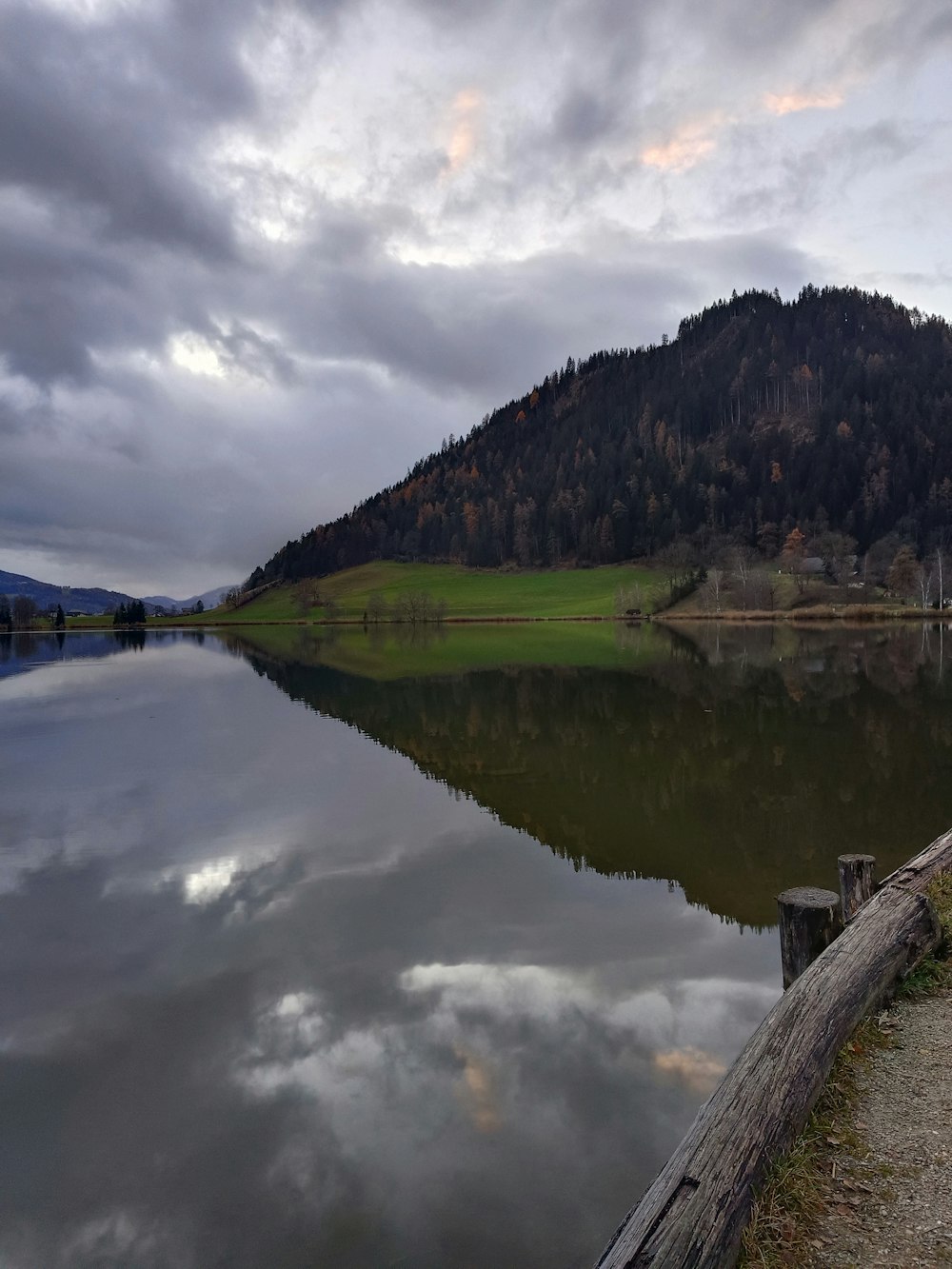 a body of water with a mountain in the background