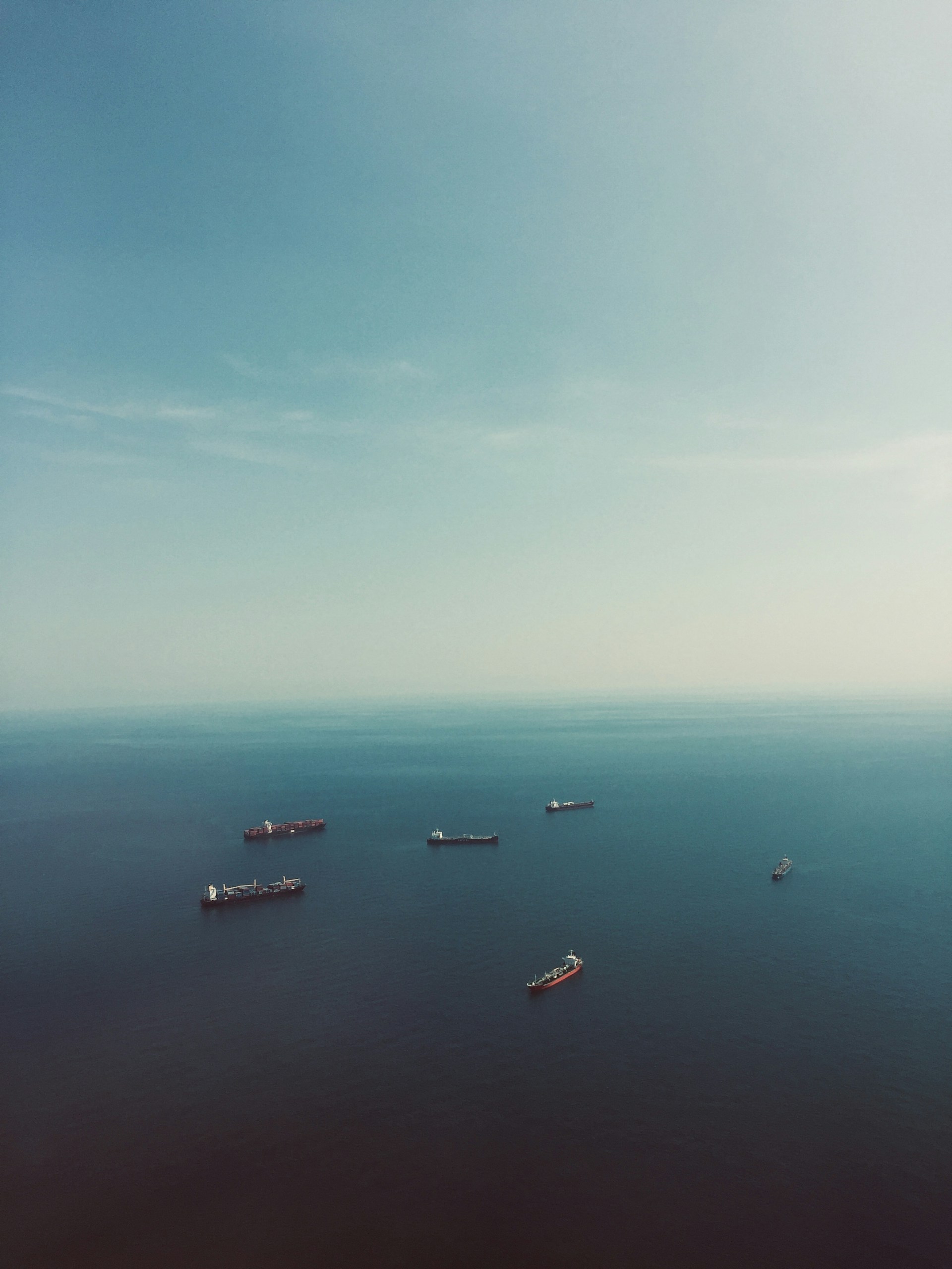 woman wearing yellow long-sleeved dress under white clouds and blue sky during daytime