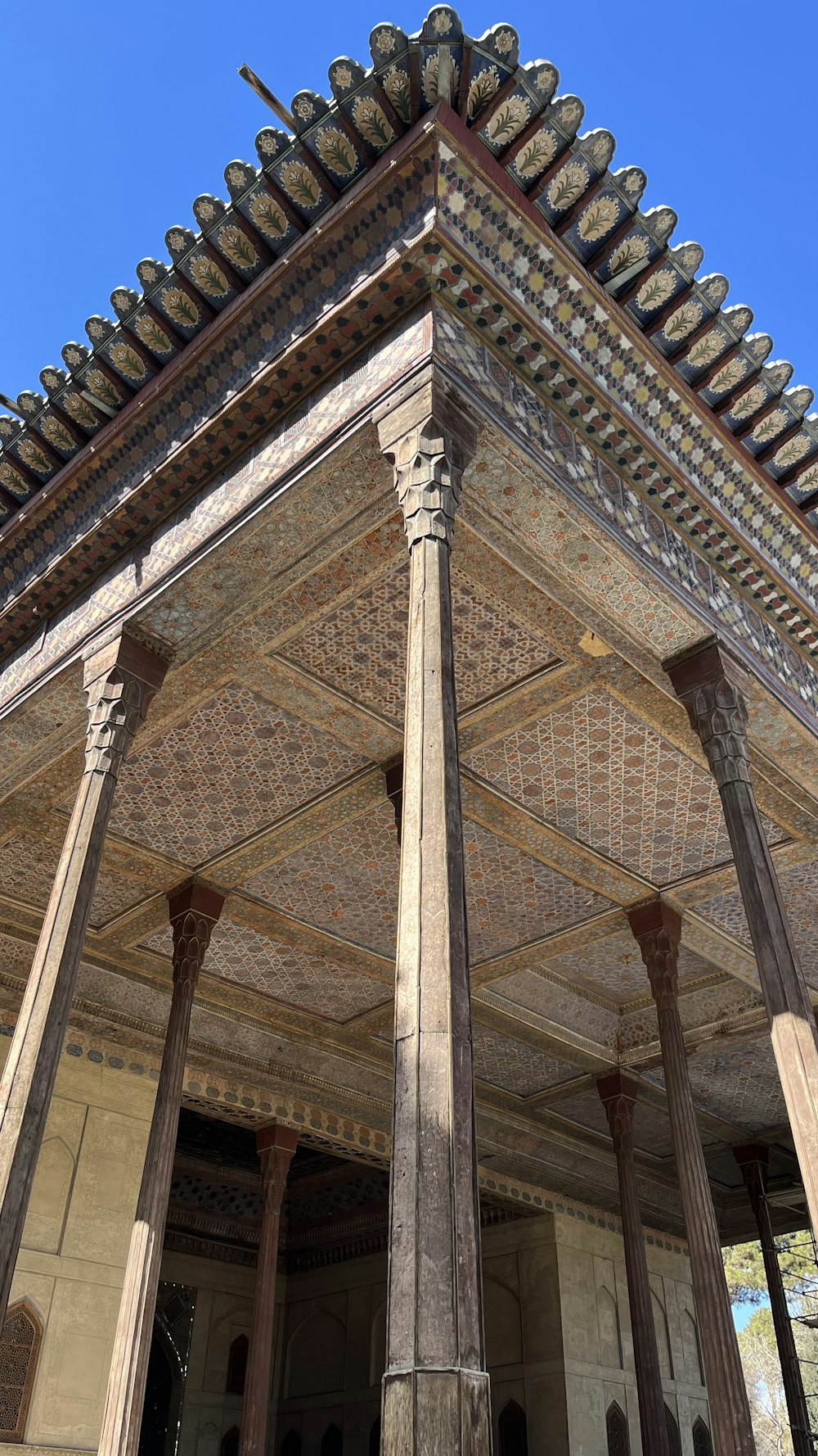 a tall building with columns and a roof